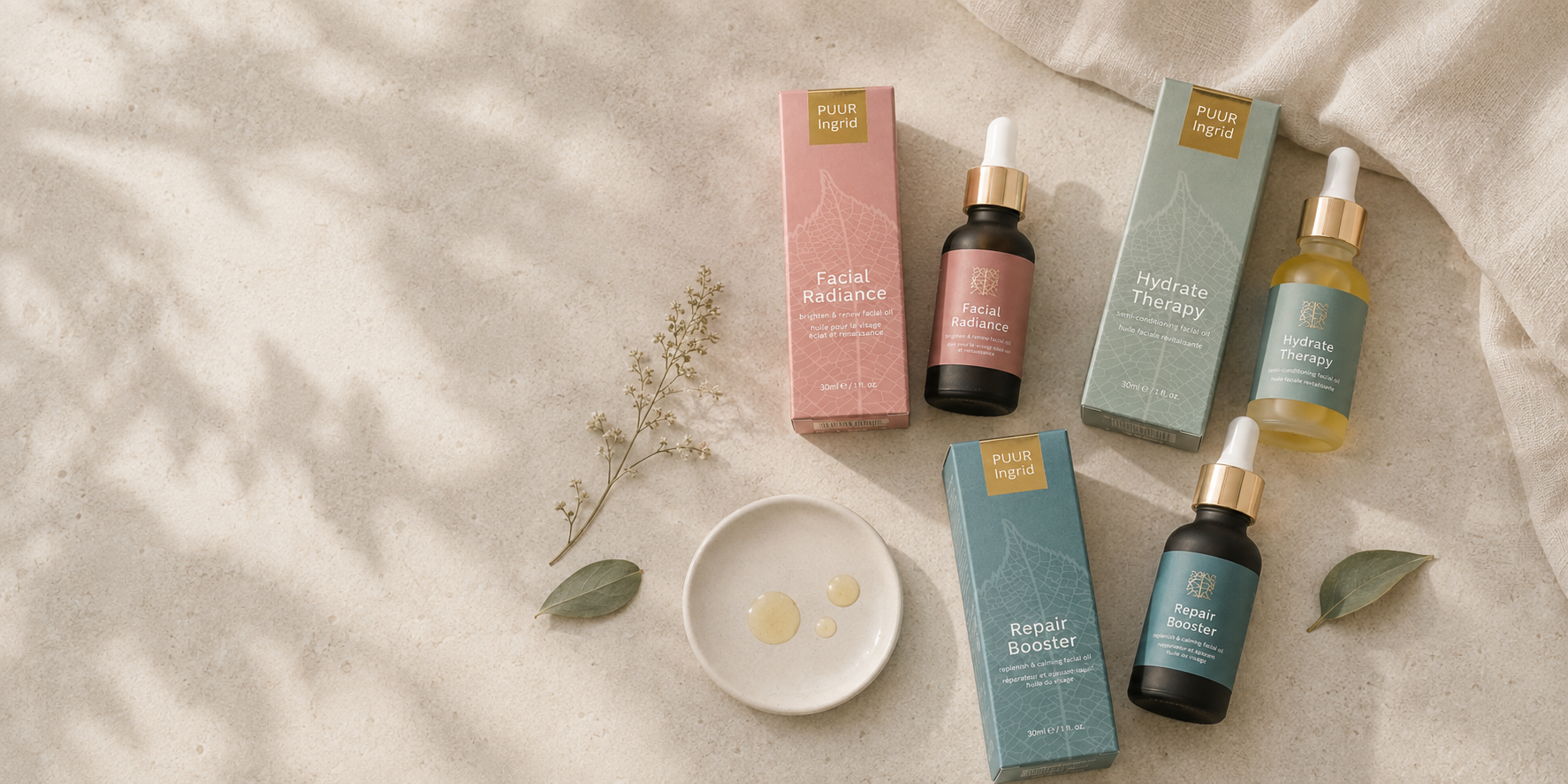 Four skincare dropper bottles with their matching boxes arranged on a light beige textured surface with soft leaf shadows. The products include Facial Mistake in pink, Hydrate Therapy in mint green, Repair Booster in teal, and Replenish Barrier in dark teal.